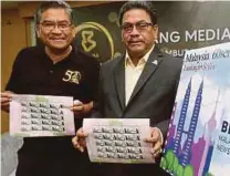  ?? PIC BY SALHANI IBRAHIM ?? Bernama general manager Datuk Zulkefli Salleh (right) and editor-in-chief Datuk Zakaria Abdul Wahab at the launch of the celebratio­n at Wisma Bernama, Jalan Tun Razak, yesterday.