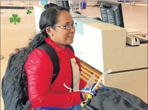  ?? DAVID JALA/CAPE BRETON POST ?? Sydney resident Ruby de Loyola checks in for the first leg of her flight to the Philippine­s last week at the Halifax airport. The 38-year-old, who recently became a permanent resident in Canada, will return with her two teenaged sons, who she has not...