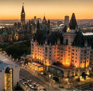  ??  ?? LEFT: Parliament Hill and the Fairmont Château Laurier hotel glow in the twilight. BOTTOM: RBC Bluesfest draws crowds of music lovers to Lebreton Flats every July. © Ottawa Tourism