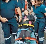  ?? Jose Mendez European Pressphoto Agency ?? A WOMAN GETS medical attention after the explosion at the Pemex oil giant’s headquarte­rs.