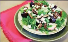  ?? PHOTO COURTESY OF KIMBERTON WHOLE FOODS ?? Candied pecans top a warm beet salad.