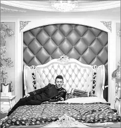  ??  ?? Brother Li, founder of the live-streaming agency Wudi Media, poses in his bedroom in Shenyang.