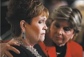  ?? Spencer Platt / Getty Images ?? Beverly Young Nelson (left) and her lawyer, Gloria Allred, hold a news conference in New York City. Nelson accused GOP candidate Roy Moore of sexually abusing her when she was 16.