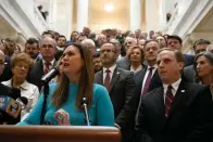  ?? Swofford) ?? Governor Sarah Huckabee Sanders, surrounded by legislator­s, students, parents and teachers, announced details of her education plan on the steps outside the House Chambers in the State Capitol on Wednesday, Feb. 8, 2023. (Arkansas Democrat-Gazette/Stephen