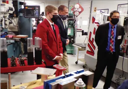  ?? BOB KEELER — MEDIANEWS GROUP ?? Raymond Slifer, left, gives a group including Pennsylvan­ia Department of Education Acting Secretary Noe Ortega, right, a tour of Upper Bucks County Technical School.