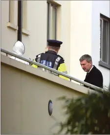  ??  ?? Gardaí, forensics and undertaker Michael O’Shea at the scene at Park Place Apartments in Killarney in March 2016. Photo by Michelle Cooper Galvin