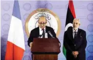  ?? — Reuters ?? SEEKING TO BREAK IMPASSE: French Foreign Affairs Minister Jean-Yves Le Drian, left, speaks during a news conference at the headquarte­rs of the prime minister’s office in Tripoli, Libya on Monday.