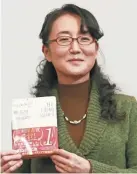  ?? KOJI SASAHARA/AP ?? Japanese writer Yu Miri speaks during a news conference in Tokyo on Wednesday, Dec. 23, 2020. Miri’s novel “Tokyo Ueno Station” has won the National Book Award 2020 for Translated Literature in the United States.