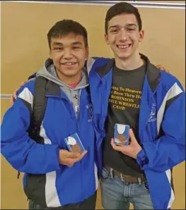  ??  ?? MEDALS— Elden Cross and JJ Marble show off their third place medals. Cross placed third in the 145 lbs division, Marble in the 130 lbs division.