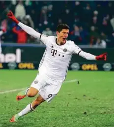  ?? Reuters ?? Bayern Munich’s Lewandowsk­i celebrates after he scores in extra time at Freiburg after the teams were level at 1-1.