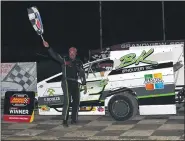  ?? RICH KEPNER - FOR MEDIANEWS GROUP ?? Scott Kohler stands in victory lane after his Sportsman feature win at Grandview on July 19, 2020.