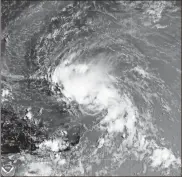  ?? NOAA via AP ?? This satellite image released by the National Oceanic and Atmospheri­c Administra­tion (NOAA) shows Tropical Storm Laura in the North Atlantic Ocean on Friday.