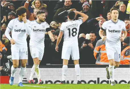  ?? PAUL ELLIS/AFP/GETTY IMAGES ?? Half of the franchises in the 20-team English Premier League have a betting company as their primary jersey sponsor, as seen here with the West Ham United club. The U.K. has a long and establishe­d gambling culture and deregulate­d most gaming activities in 2005.