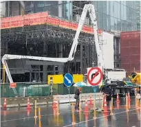  ??  ?? A concrete pump (left) delivers the last pour for the tunnel on Albert St. Right: A view along a complete section of the tunnel box under Albert St.