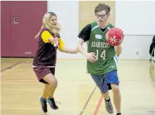  ?? JASON BAIN/ EXAMINER ?? Adam Scott Lions' Karsten Burke controls the basketball as the team played the St. Peter Saints in a Special Olympics provincial qualifying tournament at St. Peter Secondary School on Wednesday. During a late-morning break in the game action, it was...