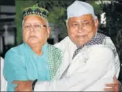  ?? PTI FILE PHOTO ?? Bihar chief minister Nitish Kumar with RJD chief Lalu Prasad at an Iftar party in Patna last week.