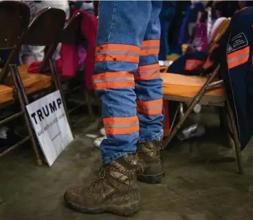  ?? Ty Wright / New York Times ?? A coal miner in uniform stands in support at a Trump campaign rally in Charleston, W. Va., in May 2016. As President Trump rolls out an executive order to dismantle climate change policies, key posts have been filled with officials who have a record of...
