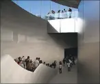  ?? JUSTIN SULLIVAN — GETTY IMAGES ?? Attendees enter the Steve Jobs Theatre at Apple Park on September 12. BuildZoom, a constructi­on data and analytics firm, estimated the cost at $1.1 billion.