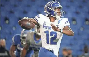  ??  ?? Memphis quarterbac­k Keilon Brown looked the most comfortabl­e at the position during the Friday Night Stripes spring game, which was expected given his familiarit­y with the offense.