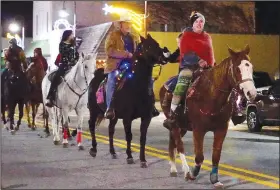  ?? (NWA Democrat-Gazette/Randy Moll) ?? A large group of horses and riders participat­ed in the parade.