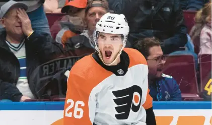  ?? ETHAN CAIRNS/THE CANADIAN PRESS VIA AP ?? The Flyers’ Sean Walker celebrates his goal against the Canucks during the second period of a Dec. 28 game in Vancouver, British Columbia.