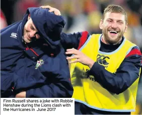  ??  ?? Finn Russell shares a joke with Robbie Henshaw during the Lions clash with the Hurricanes in June 2017