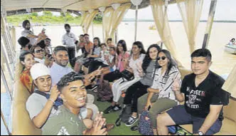  ?? HT FILE ?? The 14member group is seen in this August 8 photograph at the Sukhna Lake in Chandigarh. Jason Dosanjh (extreme right) visited his native Dosanjh Kalan village in Jalandhar district for the first time during the trip.