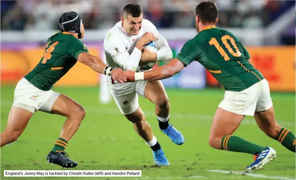  ??  ?? England’s Jonny May is tackled by Cheslin Kolbe (left) and Handre Pollard