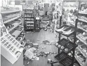  ?? MICHAEL HULL ?? Items litter the floor of a store in Sparta, North Carolina, after a 5.1-magnitude earthquake struck Sunday morning.