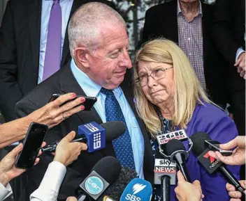  ?? PHOTO: BRENDAN ESPOSITO/EPA ?? FOUGHT HARD FOR JUSTICE: Faye Leveson is supported by her husband Mark yesterday outside the NSW Coroner’s Court in Sydney.