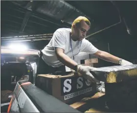  ?? AP/CARLOS GIUSTI ?? Volunteers prepare supplies for those affected by Hurricane Maria in the Roberto Clemente Coliseum on Saturday in San Juan, Puerto Rico.