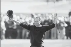  ?? Lenny Ignelzi/the Associated Press ?? Tiger Woods celebrates after winning the Farmers Insurance Open on Monday in San Diego. Woods closed with an even-par 72 to win by four shots. He now has 75 PGA wins in his career and is seven shy of Sam Snead’s record 82.