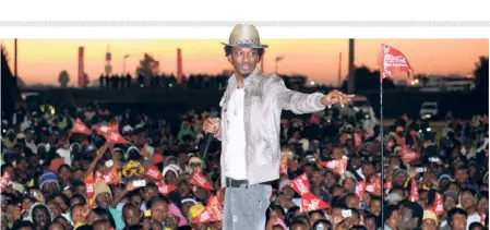  ?? GETTY IMAGES ?? Star show: K’naan performing his song ‘Wavin Flag’ at Witbank‘, in South Africa, in June 2010. The 2010 World Cup was blessed with two of the greatest songs associated with FIFA World Cups — ‘Wavin Flag’, the official anthem, and ‘Waka Waka’, the official song.