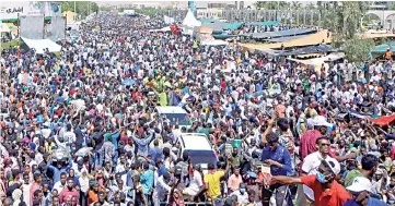  ??  ?? Sudanese demonstrat­ors chant slogans during a protest demanding Bashir steps down outside the defence ministry in Khartoum. — Reuters photo