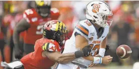  ?? GAIL BURTON/AP ?? Maryland’s Keandre Jones sacks Syracuse quarterbac­k Tommy DeVito on Sept. 7.