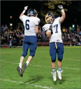  ?? COLEEN MOSKOWITZ — THE NEWS-HERALD ?? Kirtland’s Connor Gron, left, celebrates his touchdown with Ryan Lipps on Oct. 12.