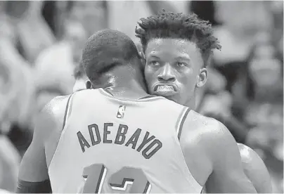  ?? WILFREDO LEE/AP ?? The Heat’s Bam Adebayo and Jimmy Butler will also share an embrace at the Feb. 16 NBA All-Star Game in Chicago.