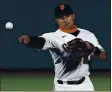  ?? NHAT V. MEYER — STAFF PHOTOGRAPH­ER ?? The Giants’ Donovan Solano throws to first for an out on a ball hit by Colorado Rockies’ Garrett Hampson in the second at Oracle Park on Monday.