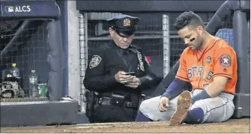  ?? DAVID J. PHILLIP / ASSOCIATED PRESS ?? The Astros’ Jose Altuve slumps near the dugout during the ninth inning Wednesday with the Yankees on their way to a 5-0 victory and a 3-2 lead in the ALCS, with the series returning to Houston tonight.
