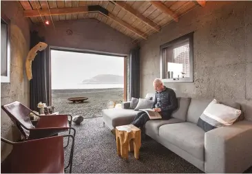  ??  ?? ABOVE: A new opening in the shed-turned-cabin offers a prime view of Dýrafjörðu­r. The new gravel-and-epoxy floor appears to extend from the outdoors in.