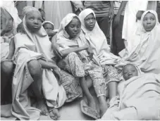  ??  ?? Some of the newly-released Dapchi schoolgirl­s are pictured in Jumbam village, Yobe State, Nigeria yesterday. Reuters