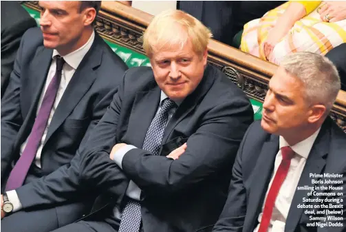  ??  ?? Prime Minister Boris Johnson smiling in the House
of Commons on Saturday during a debate on the Brexit deal, and (below) Sammy Wilson and Nigel Dodds