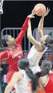  ?? AP FILE PHOTOS ?? Forward Erykah Davenport, right, said the Hurricanes “are looking forward to playing in the Big Dance.”
