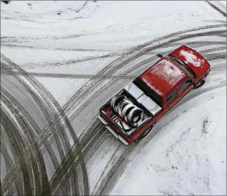  ?? ROBERT F. BUKATY/ASSOCIATED PRESS ?? If you live in an area with moderate snowfall, you can probably get by with all-season tires. But to the north, where heavy snowfall is more likely, winter tires will be better.