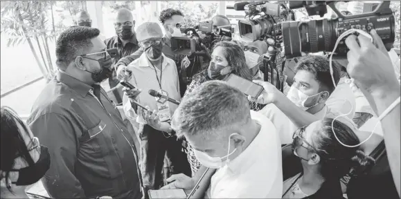  ??  ?? President Irfaan Ali (left) speaking to reporters at State House on Wednesday (Office of the President photo)