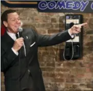  ?? ASSOCIATED PRESS ?? Joe Piscopo sings an updated “New York, New York” during an event to help raise funds for the Boys and Girls Club of America at the Stress Factory Comedy Club Dec. 6 in New Brunswick. Famous for his SNL portrayal of Frank Sinatra, the actor, comedian...