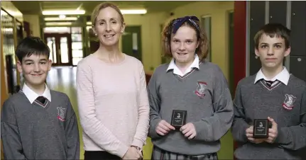  ??  ?? First Year Head Award winners Jacob Kliszcz, Sophie Kennedy and Sami O’Brien with year head Ms Coffey.