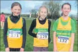  ?? ?? Lilly O’Callaghan, Natasha Leetch and Kristen McSweeney who braved the conditions for the cross country championsh­ips in Castlelyon­s.