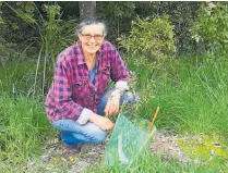  ?? ?? CHB Forest and Bird committee member LouisēPhil­lips with one of the recently planted native trees at Otaia/ Lindsay Bush in Waipukurau.