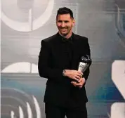  ?? Michel Euler/Associated Press ?? Argentina's Lionel Messi smiles after receiving the Best FIFA Men's player award during the ceremony of the Best FIFA Football Awards in Paris, France on Monday.